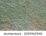 Small photo of texture of a wall with stipple paint mix of green and sand colors, rough stipple paint texture, organic tones, horizontal