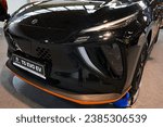 Small photo of NITRA, SK - SEPTEMBER 29, 2023: Massive front mask of modern pure battery electric compact crossover SUV (CUV) Forthing T5 EVO EV manufactured by Dongfeng. Black metallic color, displayed on car expo.