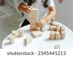 Children play with wooden toys...