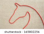 with a rope made   of horse  a... | Shutterstock . vector #165802256