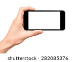 Man hand holding horizontal the black smartphone with blank screen, isolated on white background.