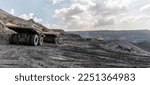 Small photo of Panoramic view of coal mine. Open pit mine industry, big yellow mining truck for coal quarry. Open coal mining anthracite mining. Pit on coal mining by open way. Rock loading in trucks. Large truck