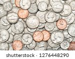 Pile of Golden coin, silver coin, copper coin, quarters, nickels, dimes, pennies, fifty cent piece and dollar coins. Various USA coins, American coins for business, money, financial coins and economy 