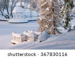 Small photo of Beautiful back yard in Palmse manor. Top view on snow-covered pond and gazebo. Large snow drifts without a trace. The attraction of the national Park Lahemaa. Estonia. Winter.