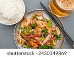 Small photo of top view mouth-watering chicken or drooling chicken with cup of rose oolong tea at horizontal composition