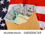 Small photo of Senate stimulus deal includes individual checks virus economic stimulus plan USA dollar cash banknote on American flag Global pandemic Covid 19 lockdown