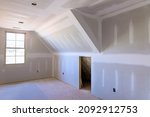 Small photo of Laid plastering gypsum on the walls and ceiling of a newly built house to drywall seams