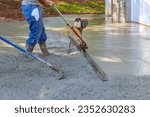 Small photo of Utilizing tamping machine to align compacted concrete on new driveways