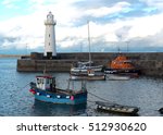 Small photo of 8 November 2016 and the Donaghadee Lifeboat sits at rest under the watchful gaze of the lighthouse.Thankfully it has been another uneventful day for both boat and crew.