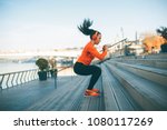 Fitness woman jumping outdoor...