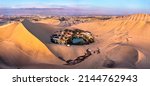 Small photo of Aerial sunset view of the Huacachina Oasis in the Atacama desert of Peru