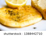 Small photo of Saganaki - a Greek dish of kefalograviera, kasseri, kefalotyri, or feta cheese, pan seared and served with lemon and bread