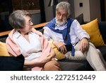 Small photo of Bearded elderly man reproaches an upset woman