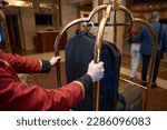 Small photo of Traveling couple walks through the foyer of a luxury hotel