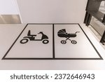 Indoor reserved parking place for mobility scooters and pushchairs