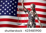Small photo of theism with scale, symbol of justice on USA flag background composition