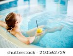 Woman Enjoying In Swimming Pool ...
