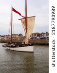 Small photo of Lowestoft, Suffolk, UK. July 30 2022. International historic smack and drifter race. Gleaner LT 64 (lugger), built 1874. Heading through the inner harbour on the river Waveney out to the north sea.