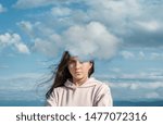 A young girl behind a cloud