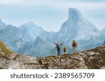 Small photo of Family travel adventure in Norway mountains, parents and child on active outdoor vacation. Mother, father, and kid hiking together healthy lifestyle tour in Lofoten islands, freedom concept