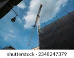 Small photo of cranes in the city center, housing incentives increase the development of new construction sites, construction sites, crane tower, eco-incentives, superbonus