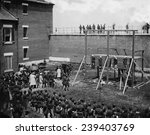 Execution of four Lincoln assassination conspirators on July 7, 1865. Hanging hooded bodies of the four conspirators: Mary E. Surratt, Lewis Payne, David E. Herold, and George Atzerodt.