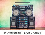 Small photo of Retro boombox ghetto blaster outdated portable radio receivers with cassette recorder from 80s front gradient colored wall background. Rap, Hip Hop, R&B music concept. Vintage old style filtered photo