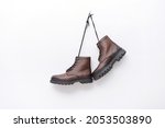  Pair of Male brown leather boots on white background 

