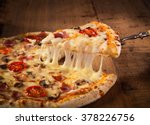 Hot Pizza Slice With Melting...