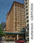 Small photo of Chicago, Illinois, USA – July 30, 2018: Vertical view of the Fisher Building facade with the Union elevated railway Loop tracks at the front from S. Dearborn St