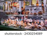 Small photo of Barcelona, Spain – April 18, 2018: Horizontal view of a delicatessen stall in the old Abaceria Central Market of the Gracia neighborhood