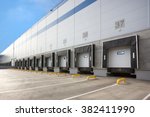 A Large distribution warehouse with gates for loading=