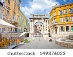 Golden Roman Gate (Sergius Arch) in Pula at sunhy day, Croatia