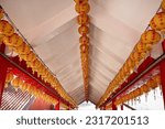 Small photo of Dali Rd., Toucheng Township, Yilan County - May 30th,2023: yellow lanterns hang on the ceiling at Caoling Qingyun Temple Dali Tiangong Temple