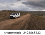 Camper van parked at the side of the road at Dynjandisheiði Heath in summer in the Westfjords, Iceland