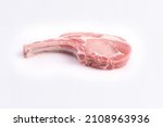 Small photo of Marbled raw pork chops meat steak or tomahawk. white background. Top view.