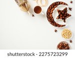 Small photo of Ramadan Kareem greeting card design. Flat lay, top view dried dates in islamic star and crescent plate, nuts, oriental lantern, cup of tea.