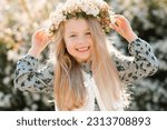 Smiling child girl wear floral...