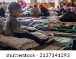 Small photo of LVIV, UKRAINE - March 12, 2022: Humanitarian catastrophe during at war in Ukraine. Millions of refugees from the war-torn territories are flees to Europe. Mother and Child Room at Lviv Railway Station