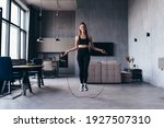 Woman skipping with jump rope...
