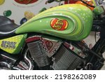Small photo of Fairfield, CA - September 3, 2022: Victory kingpin motorcycle details closeup with Jelly Belly stickers at a factory museum.