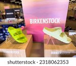 Small photo of Los Angeles, CA - June 2, 2023: Birkenstock shoes display stand inside a local shoe store.