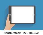 hand holing tablet computer... | Shutterstock .eps vector #220588660