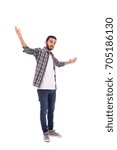 Small photo of Full length shot of handsome happy excited beard young man smiling and rising his hands, guy wearing caro shirt and jeans, isolated on white background