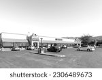 Small photo of Prince Alfred Hamlet, South Africa - Sep 9, 2022: A supermarket in Prince Alfreds Hamlet near Ceres in the Western Cape Province. Vehicles are visible. Monochrome