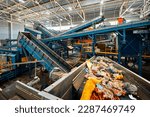 Small photo of Conveyor carries trash pieces in recycling plant workshop