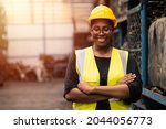 Portrait Black smart African women worker standing happy smiling in factory industry workplace