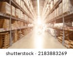 Blur large warehouse products goods stock factory inventory storage area for background