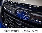 Small photo of Bangkok,THAILAND - March 30 2023: Closeup Subaru brand logo at Subaru Forester car from Subaru Corporation or Fuji Heavy Industries Japan.