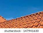 Roof Tile Pattern Over Blue Sky